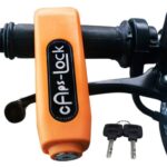 Heavy-duty bike brake lock securing a motorcycle handlebar and brake lever.