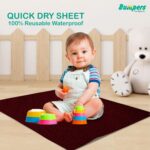 Baby sitting on Waterproof Quick Dry Sheet with toys