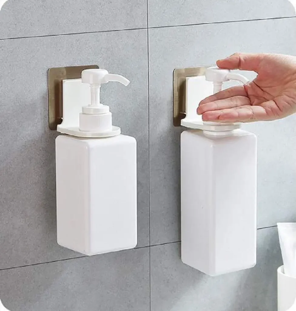 Wall-mounted shampoo bottle holder with pump dispenser for a modern, organized bathroom
