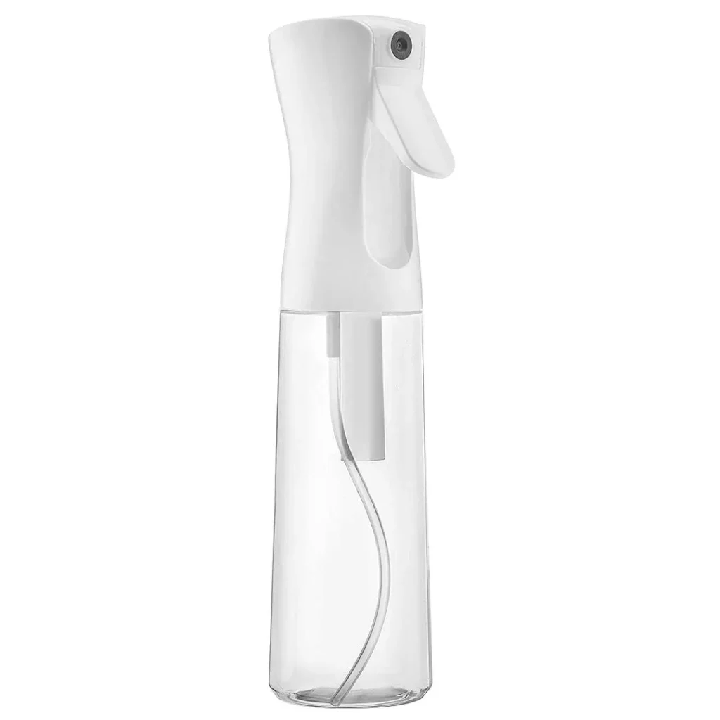 A white polyethylene terephthalate (PET) ultra-fine continuous spray bottle with a transparent 300ml reservoir and ergonomic trigger design.